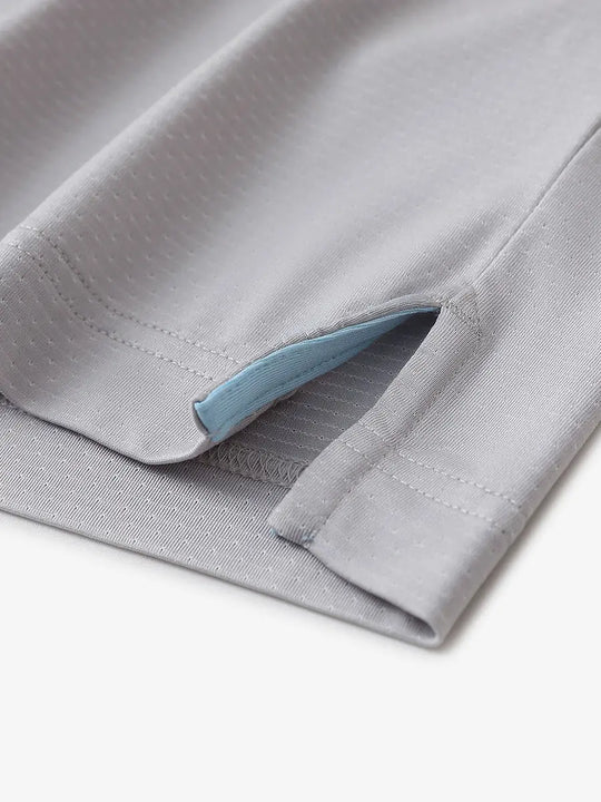 Detail of side slit hem on LIGHT GREY 4 Way Stretch Jacquard Polo — clean stitching and stretch finish