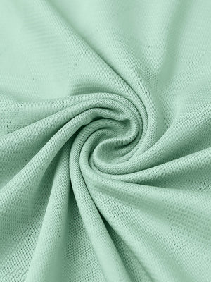 Close-up of beryl green modern texture stylish polo fabric showing surface detail.