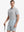 Model in LIGHT GREY Jacquard Polo posing with golf club — active and athletic on the front view