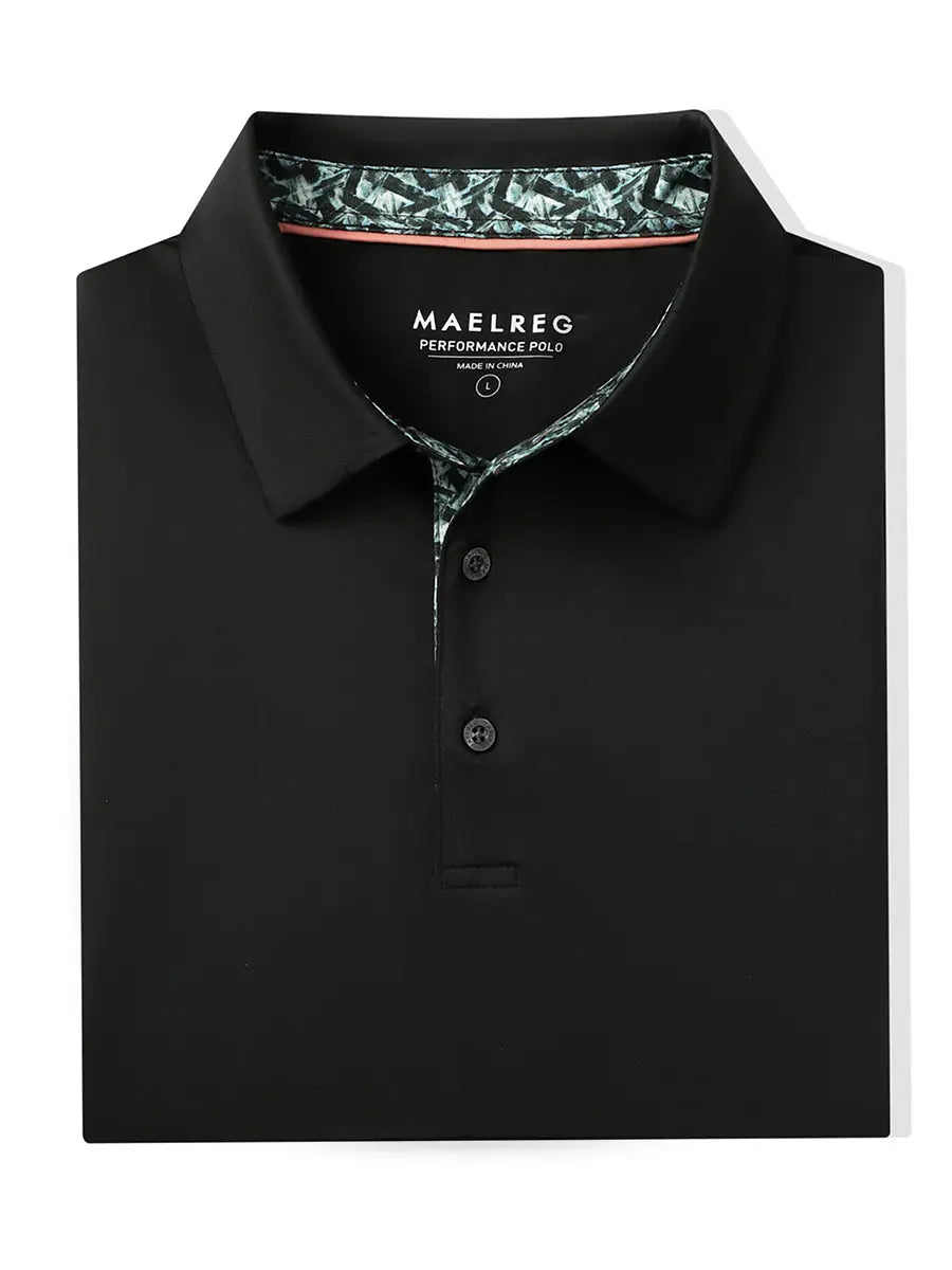 Folded Black Everyday Classic Solid Polo neatly laid out for display