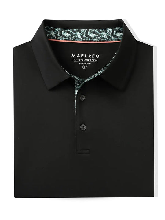 Folded Black Everyday Classic Solid Polo neatly laid out for display