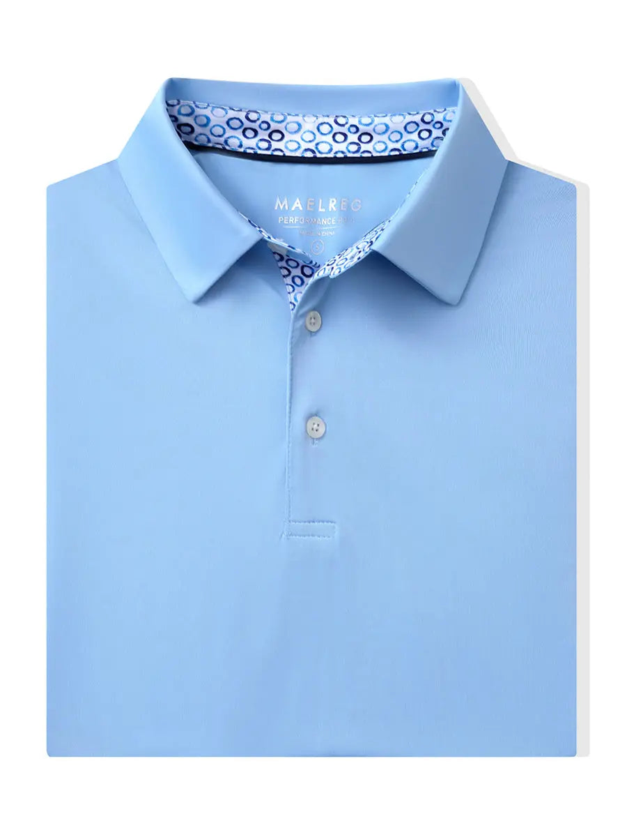 Folded Light Blue Everyday Classic Solid Polo neatly laid out for display