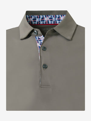 Flat lay of the folded light brown everyday classic solid polo, showcasing the neat silhouette and solid color design