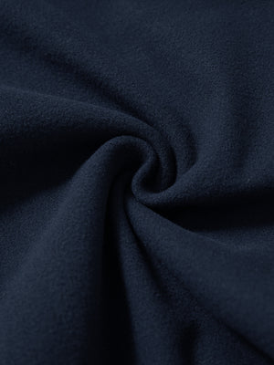 Fabric close-up of navy water resistant comfy fleece golf joggers, soft fleece texture with water-resistant finish.