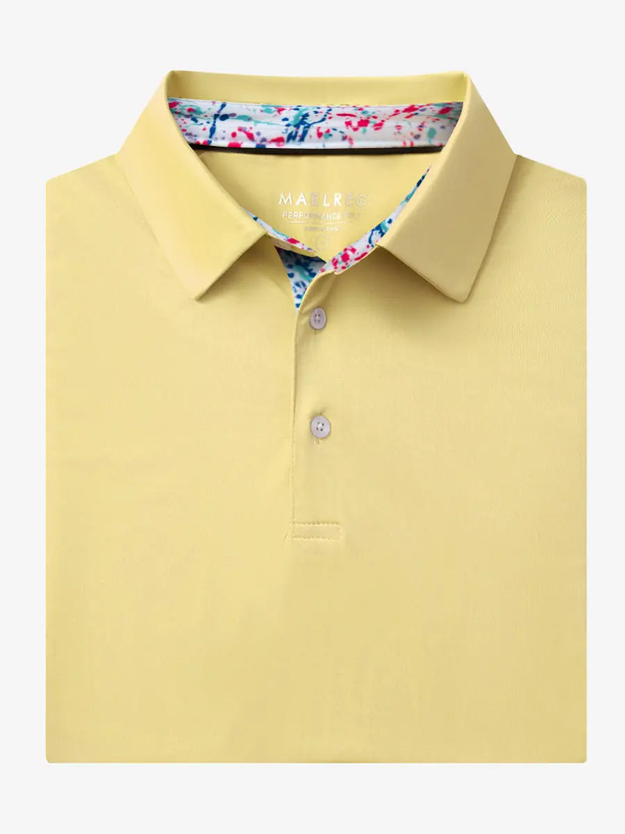 Folded Yellow Everyday Classic Solid Polo neatly laid out for display