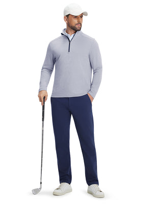 Full body shot of golfer in two tone pique cotton blend q-zip navy leaning on club