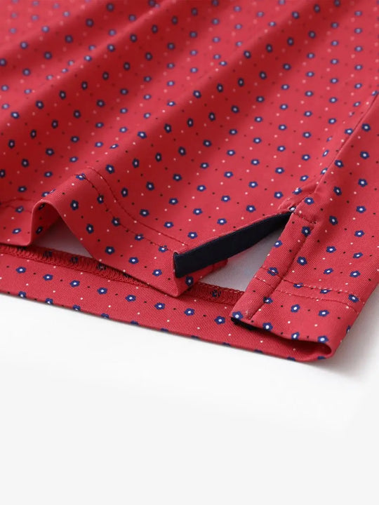 Hem slit detail of MAELREG Performance Jersey Print Polo in Red Navy Flower – comfort & movement