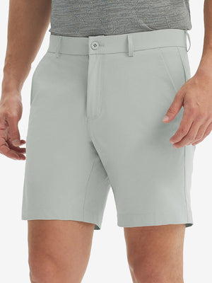 Front lower body shot of model wearing the light grey stretch soft flat front dress golf shorts, showcasing the fit