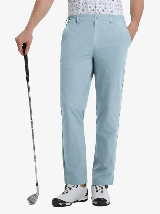 Front lower leg view of Performance Water Resistant Pants in POWDER BLUE，model holds golf club in right hand.