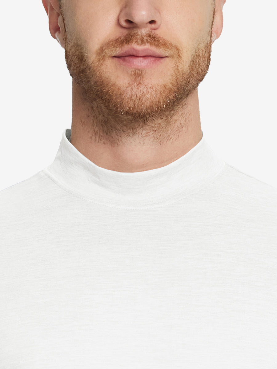 Close-up collar view from nose to chest, showing fine fabric texture of the White turtleneck.