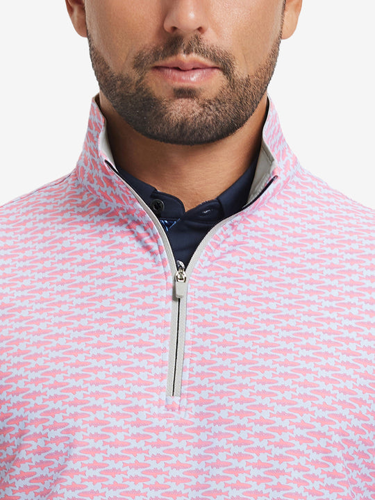 Close-up from nose to chest, showing zipper collar detail and fabric pattern of the pink small fish pullover.