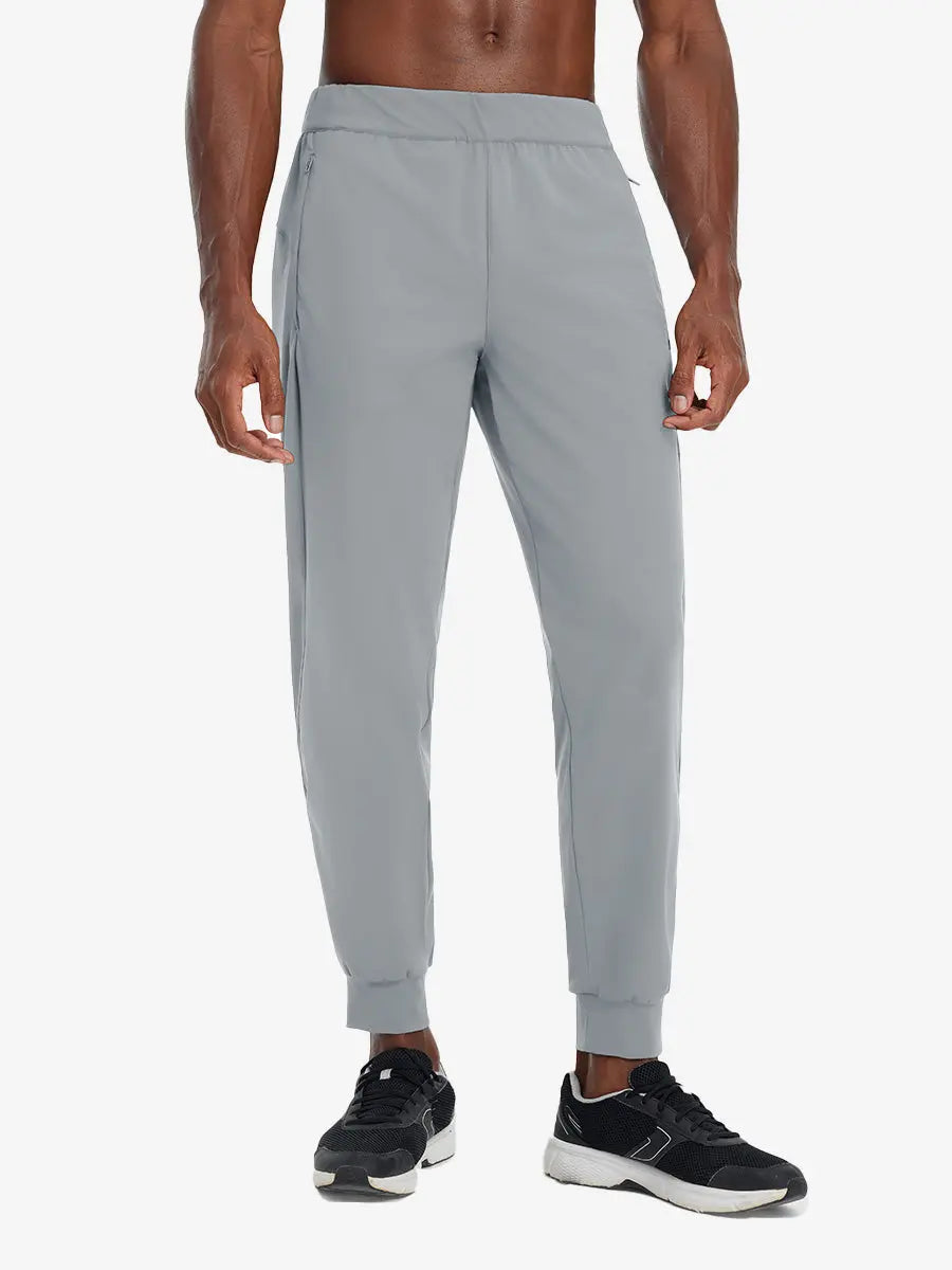 Front lower body view of model wearing LIGHT GREY Performance Tapered Sports Joggers