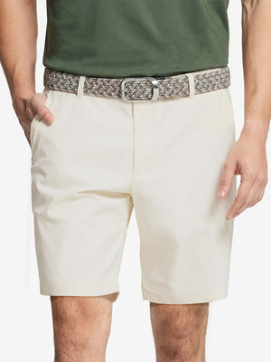 Front waist to knee view of beige water resistant golf 9 inch shorts, clean athletic fit.