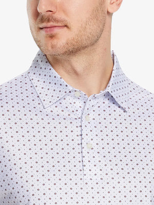 Front half-body view from nose to chest of model wearing WHITE GEO Performance Quick Dry Print Golf Polo.