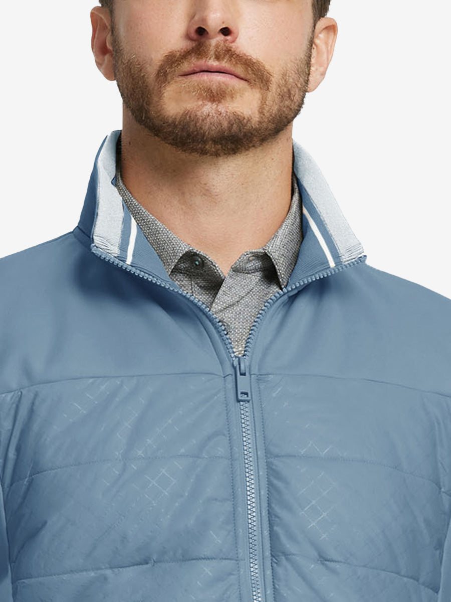 Close-up from nose to chest, showing collar detail and fleece texture of the Shadow Blue winter jacket.