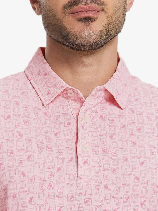 Front half-body view from nose to chest of model wearing PINK WHISKEY GLASS Popular Heather Print Polo