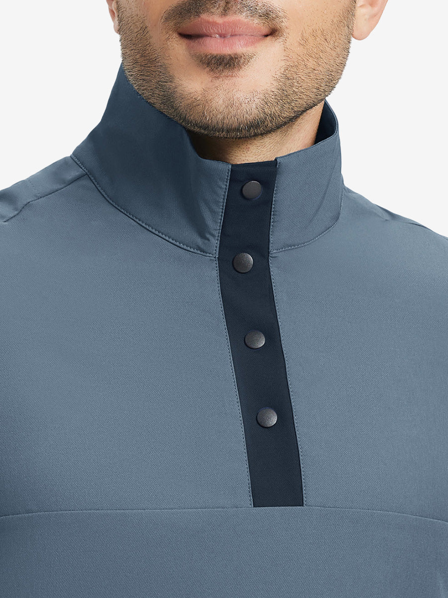 Close-up from nose to chest, highlighting buttoned collar and textured fabric of the misty blue pullover.