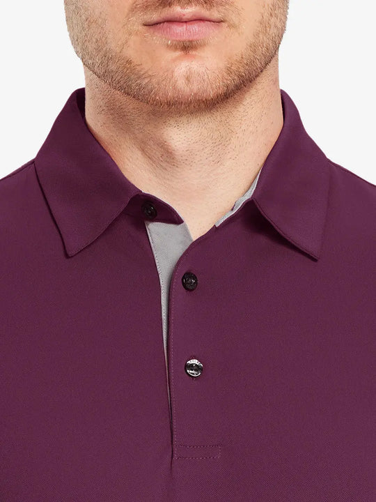 Model wearing the bordeaux red long sleeve pique polo, showcasing its elegant design and comfort.