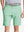 Front view of youth wearing mint green Heather Performance Golf Shorts, showing fit and style