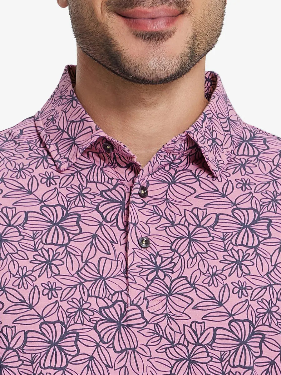 Front half-body view from nose to chest of model wearing MAUVE FLOWER Popular Heather Print Polo