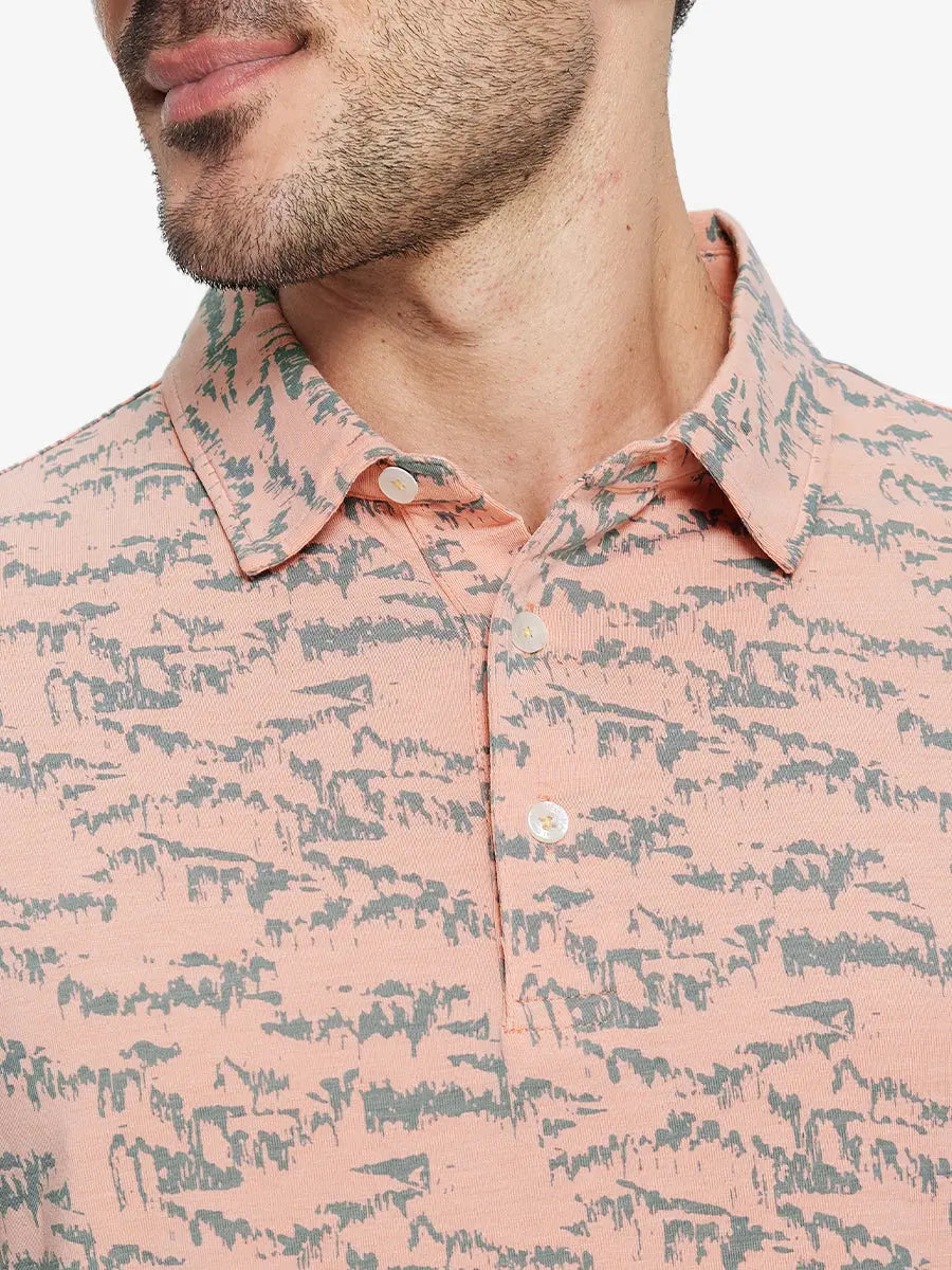 Front half-body view from nose to chest of model wearing LIGHT ORANGE MASSIF Popular Heather Print Polo