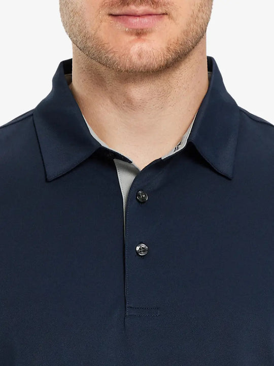 Model showcasing the navy long sleeve pique polo, emphasizing its modern style and comfort.