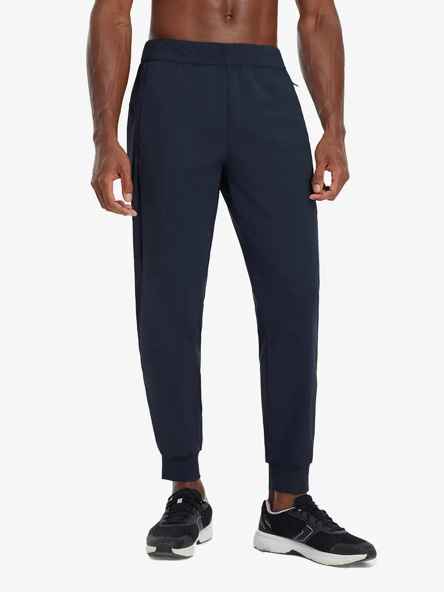 Front lower body view of model wearing NAVY Performance Tapered Sports Joggers