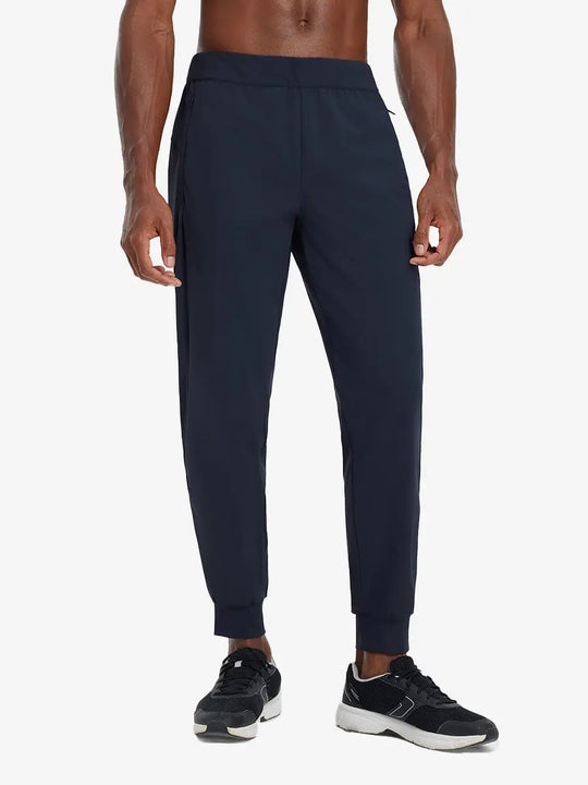 Front lower body view of model wearing NAVY Performance Tapered Sports Joggers
