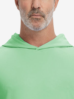 Close-up from nose to chest, showing soft collar texture and stitching detail of the light green hoodie.