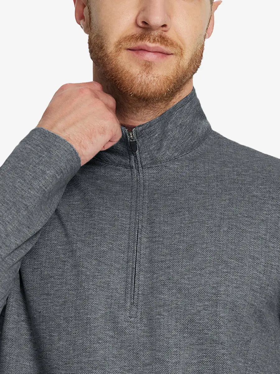 Front half-body view from nose down of model wearing DARK GRAY HERRINGBONE Premium Jacquard Quarter Zip Pullover.								
