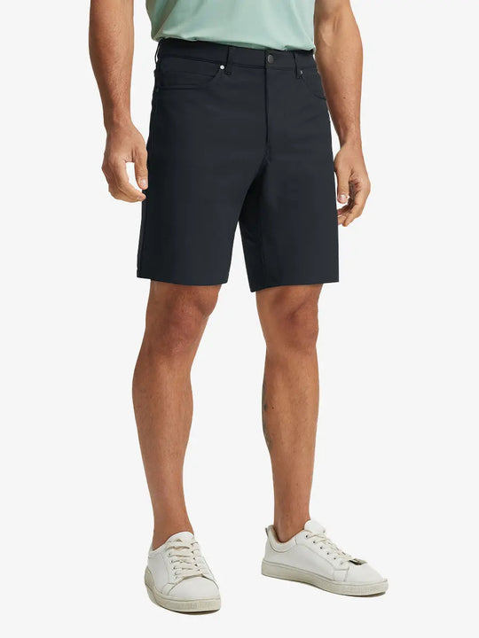 BLACK 4-way Stretch Performance Solid Shorts, golfer front lower body with club, 9 Inch view