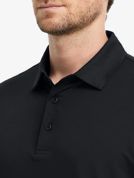 Close-up of Everyday Solid Jersey Polo front (nose to chest) in BLACK, showing fabric texture detail.