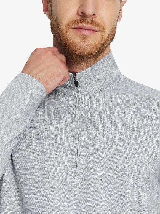 Front half-body view from nose down of model wearing LIGHT GRAY HERRINGBONE Premium Jacquard Quarter Zip Pullover.								
