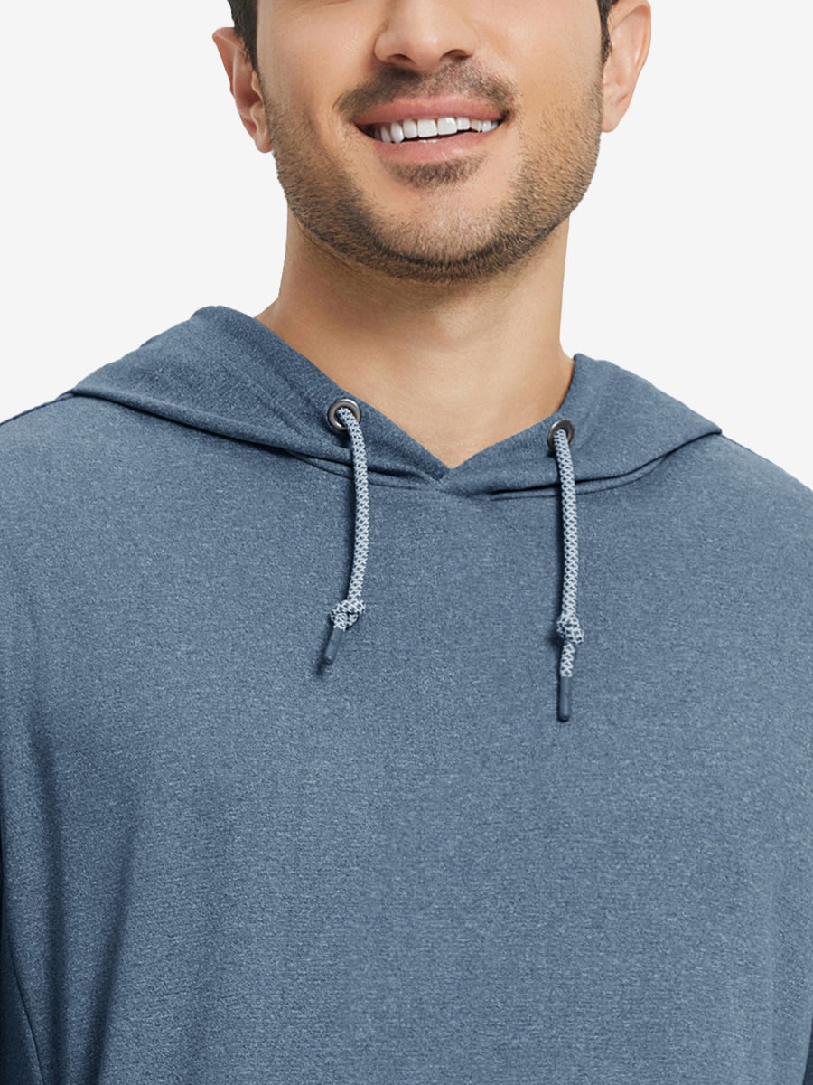 Close-up from nose to chest, showing soft heather texture and collar detail of the navy melange hoodie.