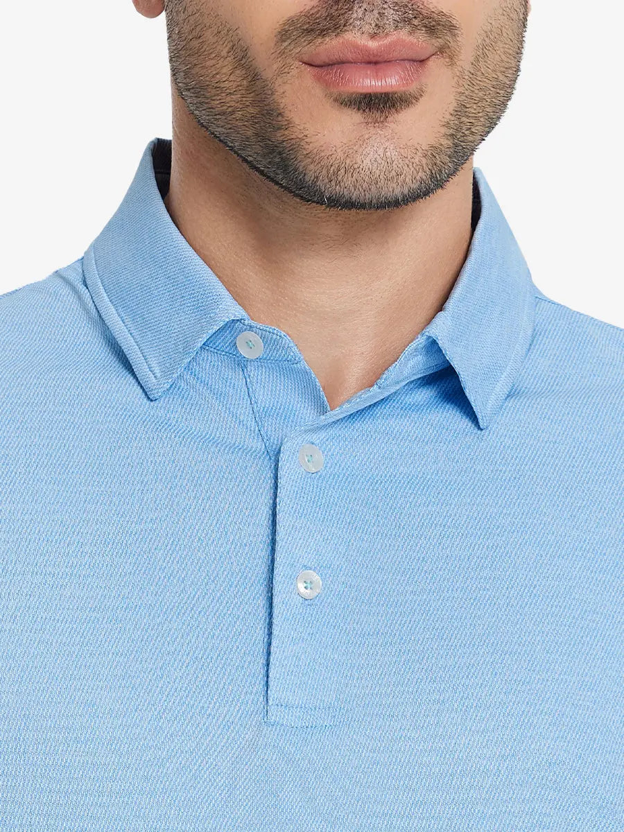 Front half-body view from nose to chest of model wearing BLUE HEATHER Premium Stretch Heather Polo.
