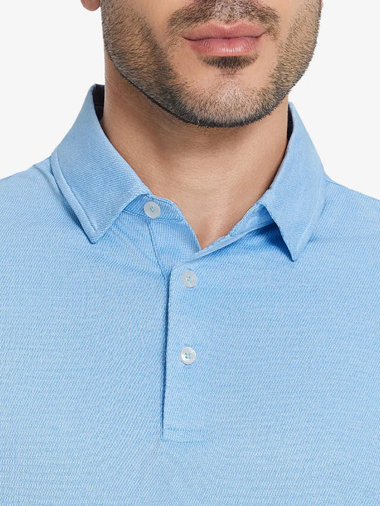 Front half-body view from nose to chest of model wearing BLUE HEATHER Premium Stretch Heather Polo.