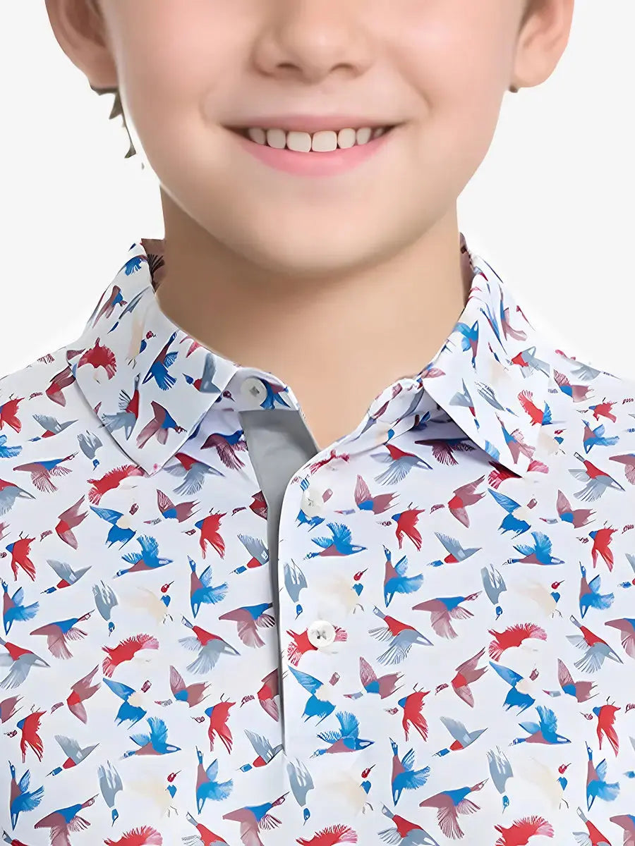 Close-up front view from nose to chest of boy wearing COLORFUL WILD GOOSE Performance Print Boys Golf Polo