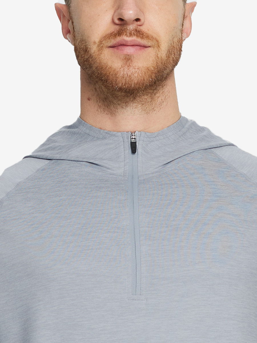 Close-up of collar detail from nose to chest, highlighting fabric and stitching of Faded Denim Heather hoodie.