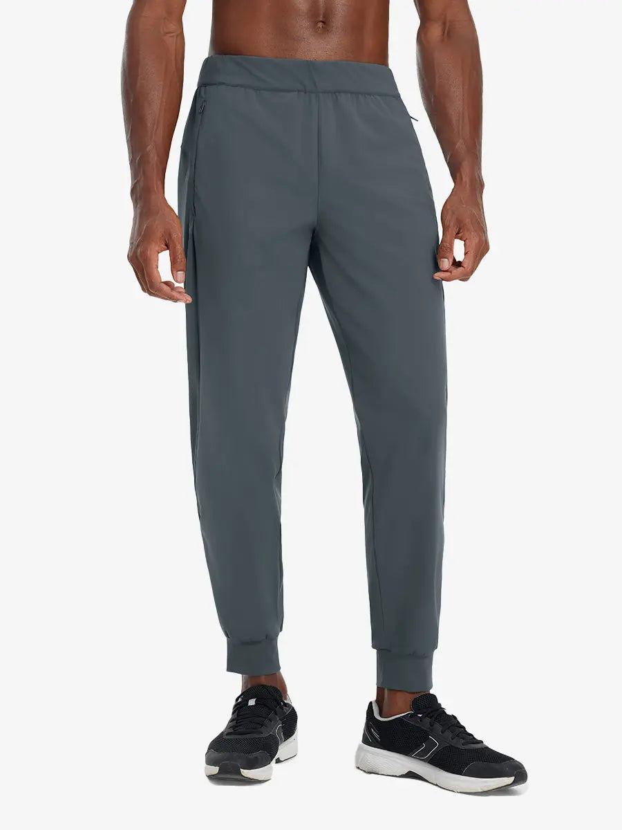 Front lower body view of model wearing DARK GREY Performance Tapered Sports Joggers