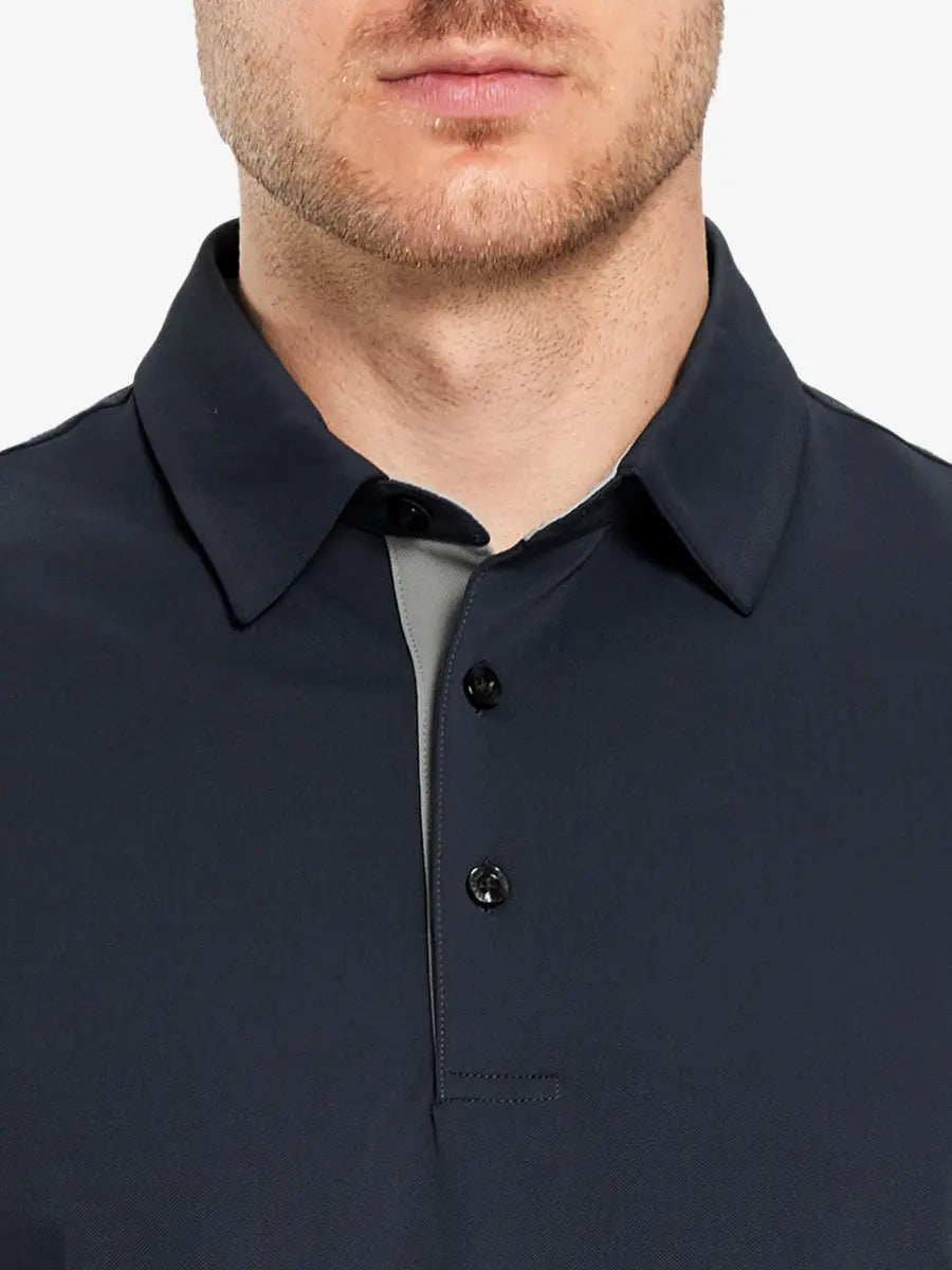 Model showcasing the dark grey long sleeve pique polo, highlighting its modern and sleek design.
