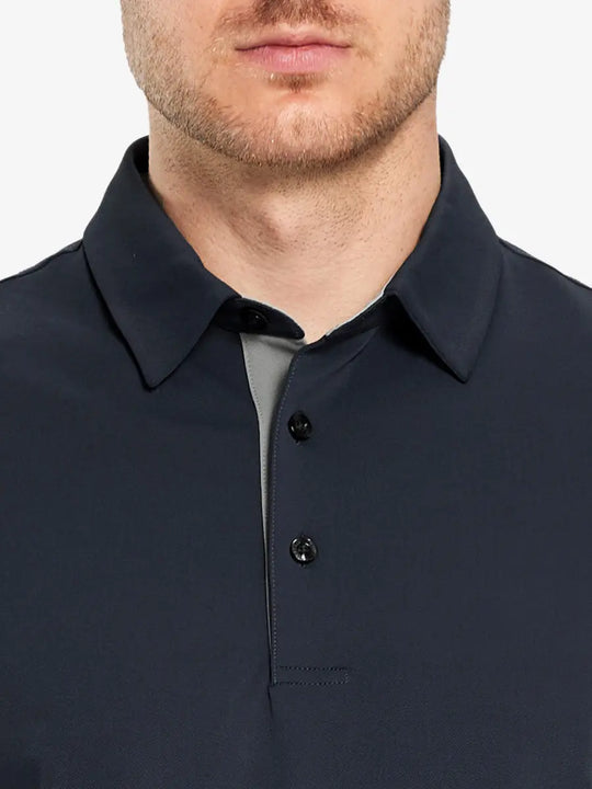 Model showcasing the dark grey long sleeve pique polo, highlighting its modern and sleek design.