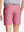Back view of youth in pink Heather Performance Golf Shorts, highlighting rear design and fit