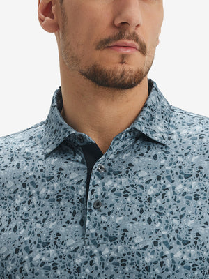 Close-up of lower face and upper shirt in Performance quick dry print golf polos, camo fragments detail