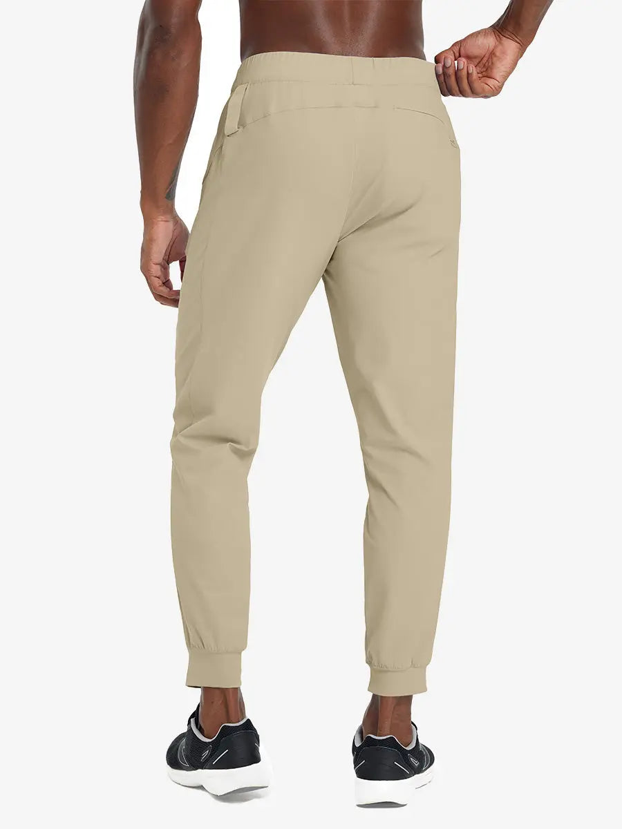 Back lower body view of model wearing KHAKI Performance Tapered Sports Joggers