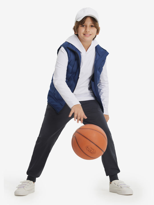 Full-body view of model holding basketball, wearing youth long sleeve hoodied with kangaroo pocket in white.