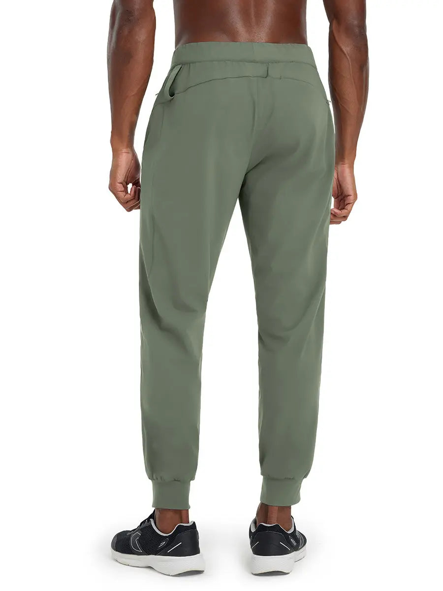 Back lower body view of model wearing OLIVE GREEN Performance Tapered Sports Joggers