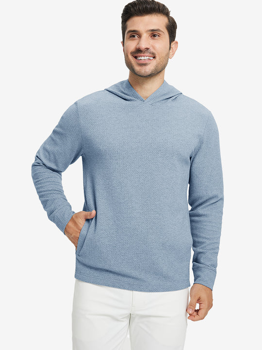 Model front upper body, one hand in pocket, wearing texture solid hoodies pullover, blue heather.