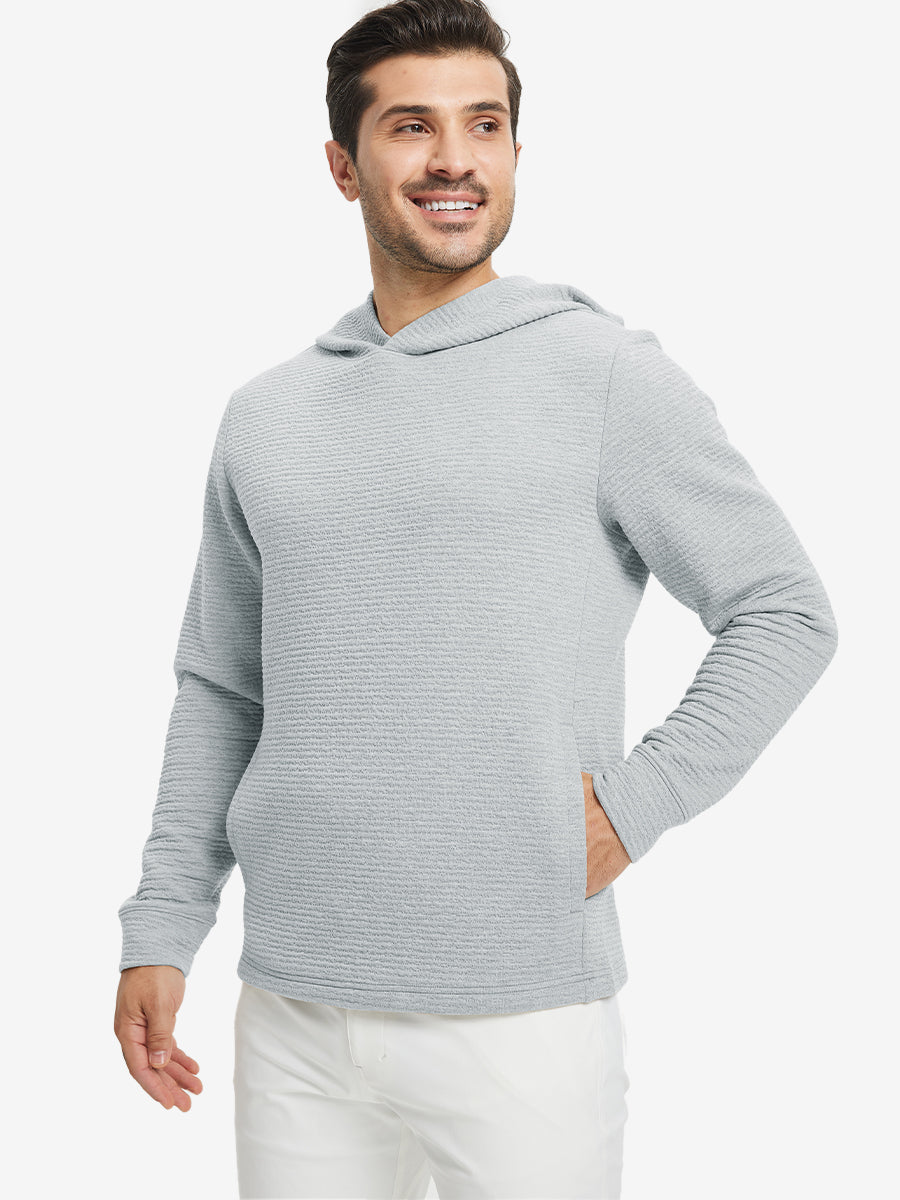 Model front upper body, one hand in pocket, wearing texture solid hoodies pullover, light grey heather.
