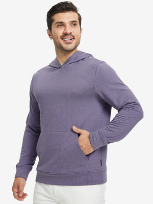 Model front view with one hand in side pocket wearing warm fleece golf hoodies pullover purple.