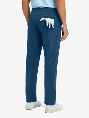 Back view of blue indigo quick dry casual dress pants, golf glove tucked in rear pocket for sporty touch.